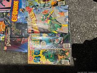 Photo showing a group of approximately 10 comics from the lot: Elf Warrior, Weird War Tales, and others with visible wear.