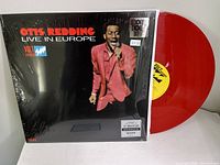 Red translucent vinyl record partially pulled out from album cover, showing yellow center label with Volt Records logo and catalog number 081227932794.