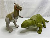 Front view of the Patrol Dewback and Tauntaun figures showing color and size comparison.