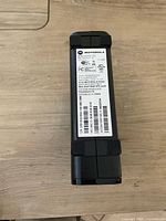 Photo of the back of the Motorola MOTO Q9h smartphone showing the label with model information and regulatory details.