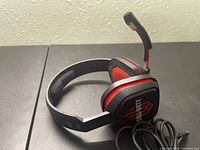 Side angle view of Call of Duty gaming headphones, showing cushioned ear cups, headband, and attached boom microphone.