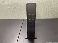 Front view of Netgear AC1900 C7100V cable modem voice router showing LED status lights