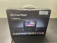 Front view of retail box showing brand CyberNet and 7-inch netbook with Android 4.0 features and specs