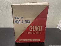 Original box labeled with 'DUAL-8 MOD. A-203','GOKO FILMBETRACHTER' and manufacturer Sansei Koki Co. Ltd. in Japan.