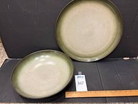 Bowl and platter side by side with ruler for scale
