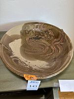 Full top view of the large glazed bowl showing overall shape, color, and 17 inch size note.