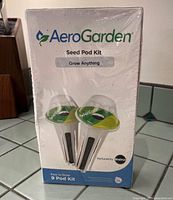 Front of sealed AeroGarden Seed Pod Kit box showing branding and 9 Pod Kit label