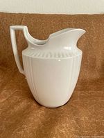 Left side view showing full profile including handle, body design and spout