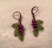 Full view of both earrings showing bead clusters, leaf beads and leverback hooks