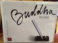 Front of sealed Buddha Board retail box