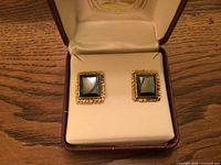 pair of hematite gold nugget earrings in open Hudson’s Bay box