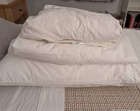 Stack showing pillow on bottom, bedding pieces on top