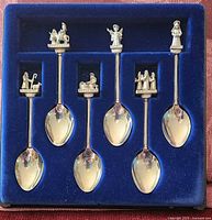 Set of six pewter nativity teaspoons in blue display tray