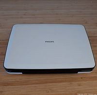 Closed Philips portable DVD player showing white lid