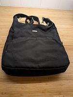 Front view of black Travelon shoulder handbag