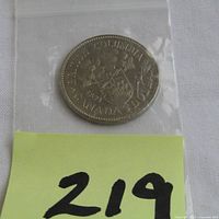 1971 Canadian $1 coin in plastic bag with handwritten lot number.