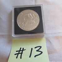 Reverse side of the 1983 Canada silver dollar showcasing the University of Edmonton emblem.