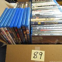Two rows of Blu-ray movie cases stacked box showing majority of titles
