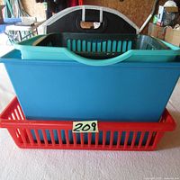 Stacked bins showing blue and red plastic storage bins with slatted red baskets.