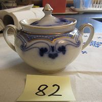 Top view of antique Flow Blue Idris sugar bowl with lid, showing overall condition and gold trim detail.