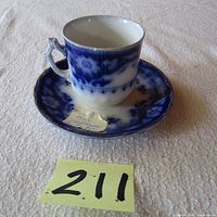 Cup and saucer together showing overall shape, pattern, and condition.