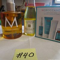 Image showing complexion of Moroccanoil hand wash, Eminence apricot body oil, and boxed Moroccanoil Hair & Body Minis set.