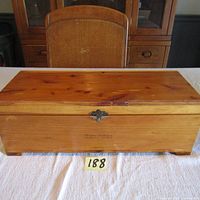 Front view of the cedar box showing wood grain and latch lock