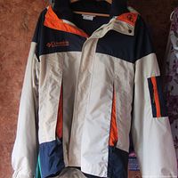 Front view of Columbia hooded jacket showing color block design and pockets