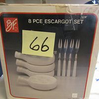 Outer box of the 8 pc escargot set with brand logo and product image showing 4 dishes and 4 forks.