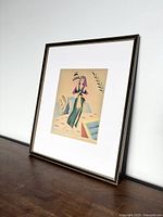 Framed airbrush artwork featuring a stylized female figure in Art Deco style, placed against a white wall.