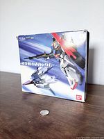 Front of the worn box displaying the Bandai Z Gundam figure art and branding.