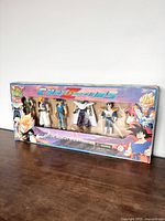 Photo of original box with six Dragon Ball Z Cyber Z Fighters bootleg action figures visible inside.