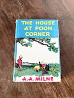 Front cover of the book with dust jacket showing title and characters