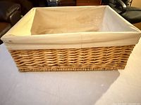 Side view of rectangular wicker basket with fabric liner