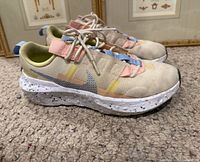 Side view of both Nike Crater Impact shoes