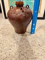 Full view with ruler showing height and shape