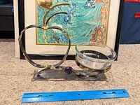 overall view of apple stand with glass bowl and ruler for scale