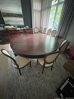 Full view of round table surrounded by chairs