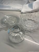 Photo showing all three items in the set: crystal bowl, glass plate, and glass dome close-up.