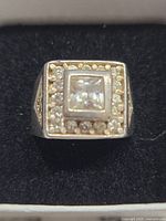 Top view showing the square central crystal surrounded by smaller round crystals embedded in the sterling silver setting.