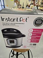 Front image of Instant Pot box showing product name, features, and model number IP-DUO60 V3.