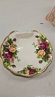 Top view of the soap dish showing floral pattern and gold gilded edges