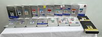 Fifteen silver Disney Treasures DVD tins on table, front and back rows.