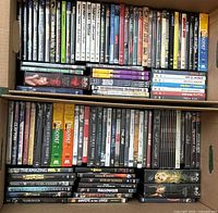 Overhead view of DVDs in box showing two shelves