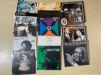 Group photo of 11 assorted jazz vinyl record albums from various artists.