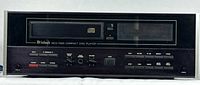 Front view of CD player showing disc tray, display, and control buttons