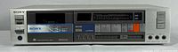 Front view of the Sony cassette player, showing the entire unit with cassette compartment and control buttons.