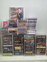 Four towers of boxed CD and cassette sets of classic radio shows arranged on shelf