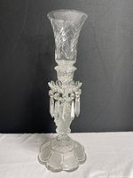 Full view of the vintage frosted glass stem candle holder with leaf pattern details on chimney and crystal prisms hanging on ring below candle cup