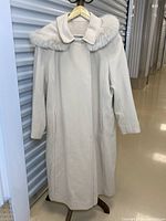 Front full view of coat on hanger showing overall style and collar